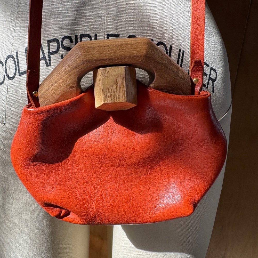 Vibrant Orange Leather Crossbody Bag with Wooden Handle
